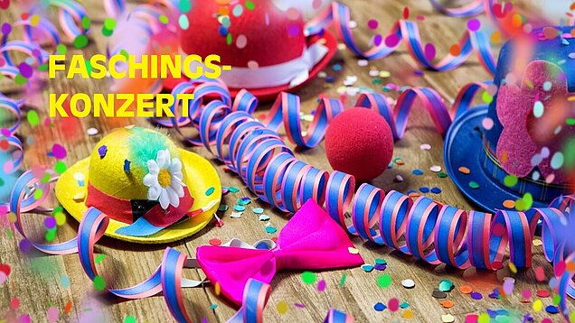 Buntes Bild mit Konfetti und Girlanden mit Schriftzug Faschingskonzert